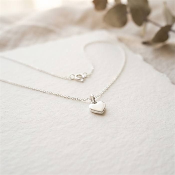 A heart necklace representing the Hearts for Mom Fund